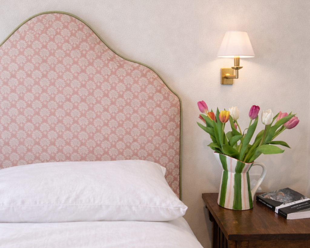 Pink headboard with green piping